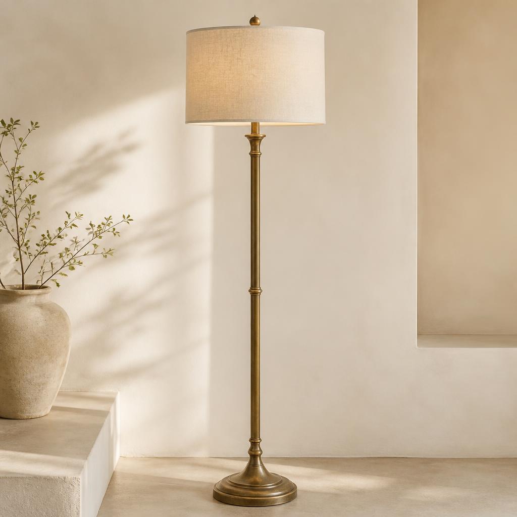 Floor lamp — Slim turned column with a warm linen drum shade